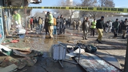 Security officials inspect the scene of the bomb