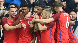 Marcus Rashford is mobbed by team-mates after his goal against Australia Marcus Rashford is mobbed by team-mates after his goal against Australia