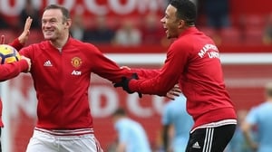 Wayne Rooney and Memphis Depay (but does he own a Chevrolet?) Wayne Rooney and Memphis Depay (but does he own a Chevrolet?)