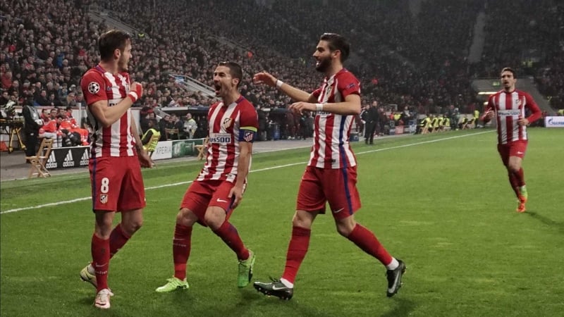 Saul Niguez (L) and team mates celebrate