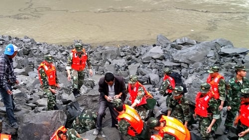 Hopes fading in China for 118 still missing day after landslide