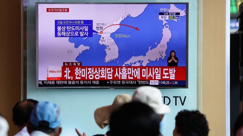 People watch a television broadcast reporting the North Korean missile launch at the Seoul Railway Station in South Korea