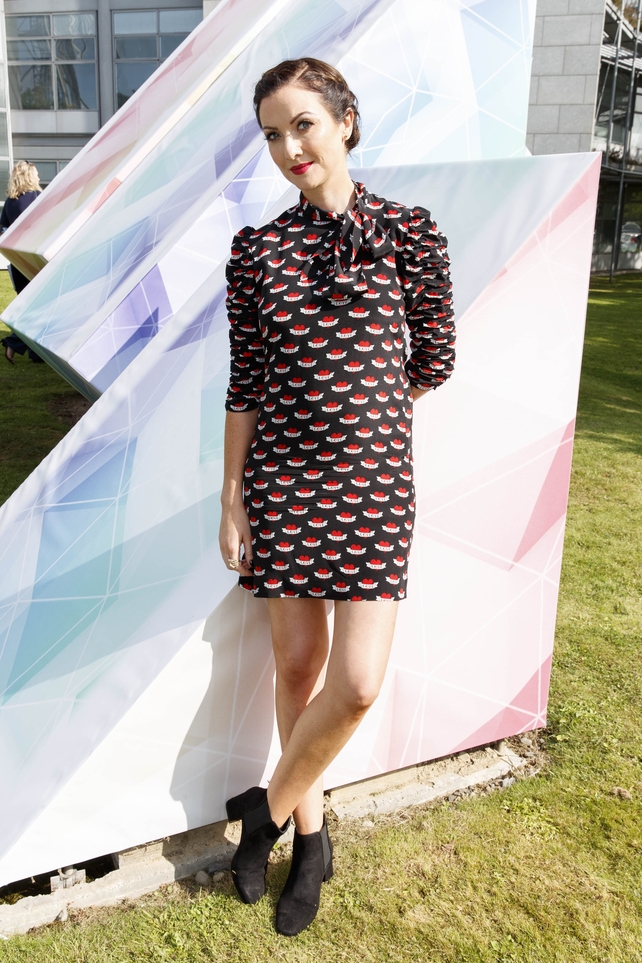 Jenifer Zamparelli wore a patterned shift dress by Sandro with a pair of heeled black ankle boots. Jen knows how to rock her maternity wear.