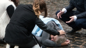 Robert is unconscious after being knocked to the ground on Coronation Street Robert is unconscious after being knocked to the ground on Coronation Street