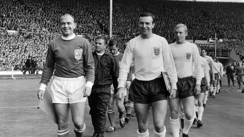Jimmy Armfield (right) leads out England alongside Alfredo Di Stefano, captain of the Rest Of The World team