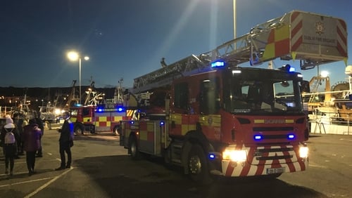 Vehicle falls into Howth harbour; emergency services at scene