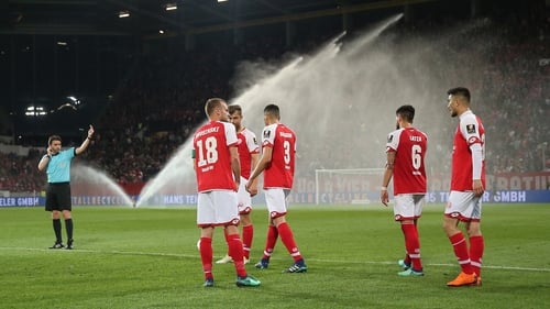 The sprinklers were on at half-time as the players were ordered back onto the pitch