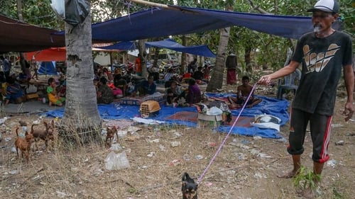Many frightened villagers are staying under tents or tarpaulins dotted along roads or in parched rice fields