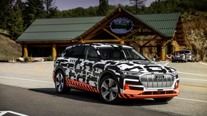 A disguised test version of Audi's first all-electric SUV. A disguised test version of Audi's first all-electric SUV.