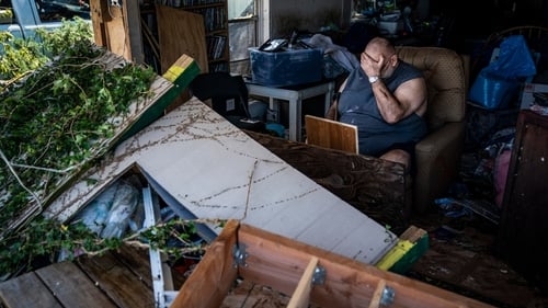 Benny Hobson 69 sits in what is left of his home in Panama City Florida