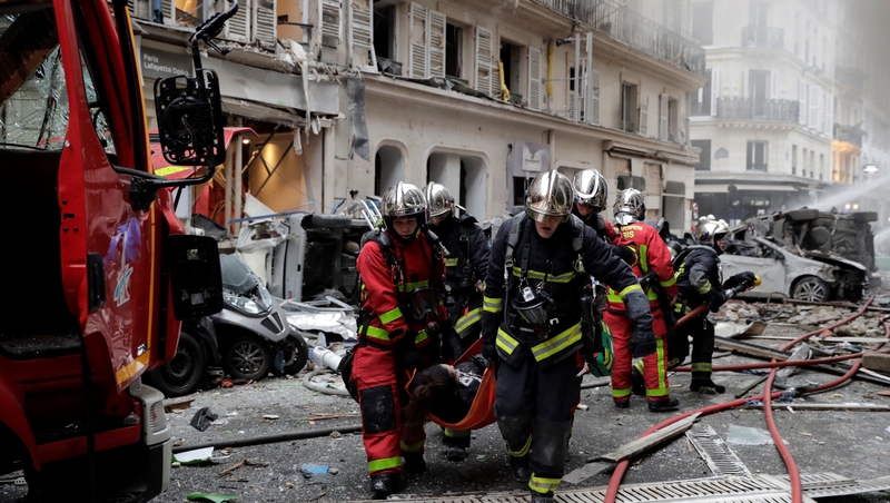 An injured person is taken from the scene