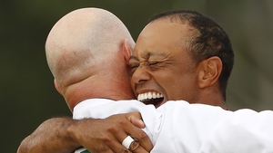 Woods celebrates with caddie Joe LaCava Woods celebrates with caddie Joe LaCava