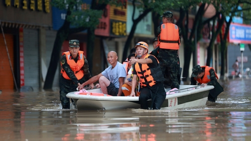 Footage showed fields and streets flooded by muddy water submerged vehicles and trees blown over