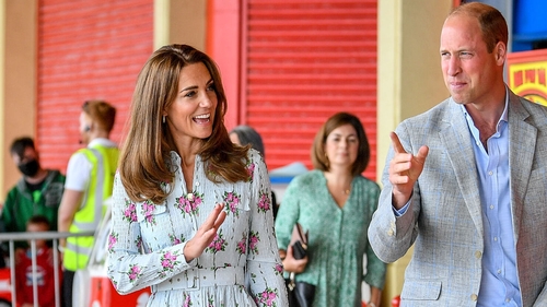 Kate matches her mask to her dress in feminine floral number Kate matches her mask to her dress in feminine floral number