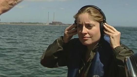 Reporter Emma O'Kelly listening to dolphins in the Shannon Estuary (2006)