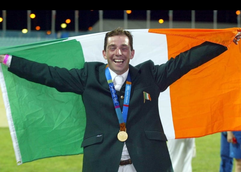 A delighted Cian O'Connor celebrates winning the gold medal