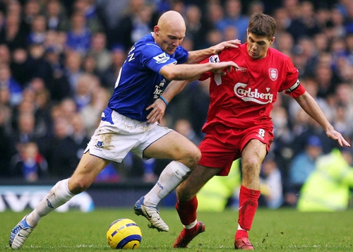 Thomas Gravesen (left) tussles with Steven Gerrard, another midfielder linked with a move from Merseyside to Madrid