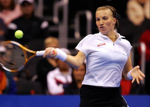 Defending champion Svetlana Kuznetsova was bundled out of the first round of the US Open by compatriot Ekaterina Bychkova