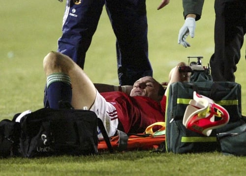 Lawrence Dallaglio is treated by Lions medical staff after breaking his ankle against Bay of Plenty