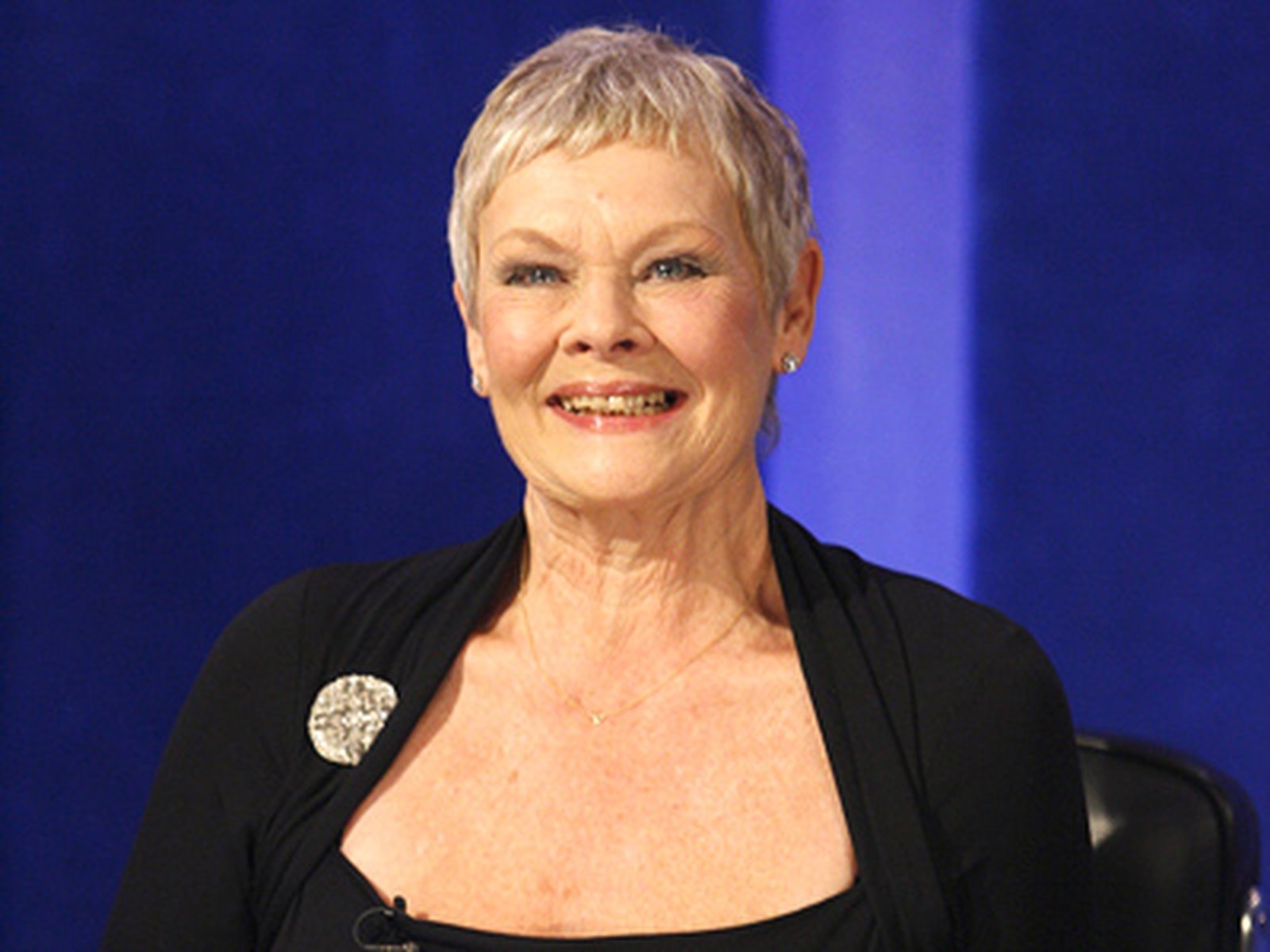 Judi Dench has tooth trouble