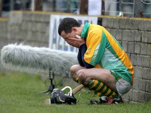 Tommy Dunne shows his despair at being sent off