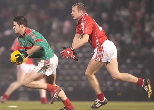 Mayo's James Kilcullen gets away from Cork's James Masters in the Connacht side's win in Páirc Uí Rinn