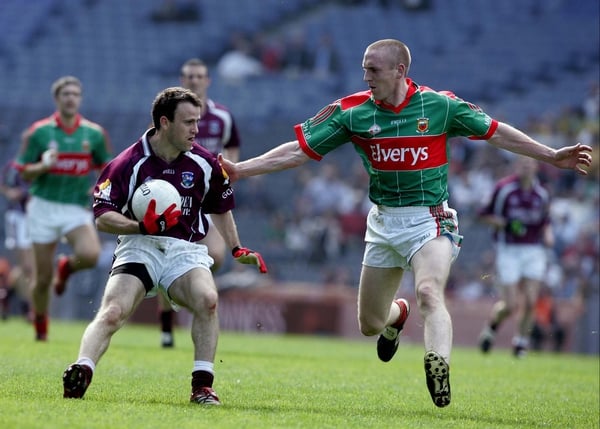 Galway's Derek Savage is watched by Mayo's David Heaney in the NFL Division One semi-final in Croke Park