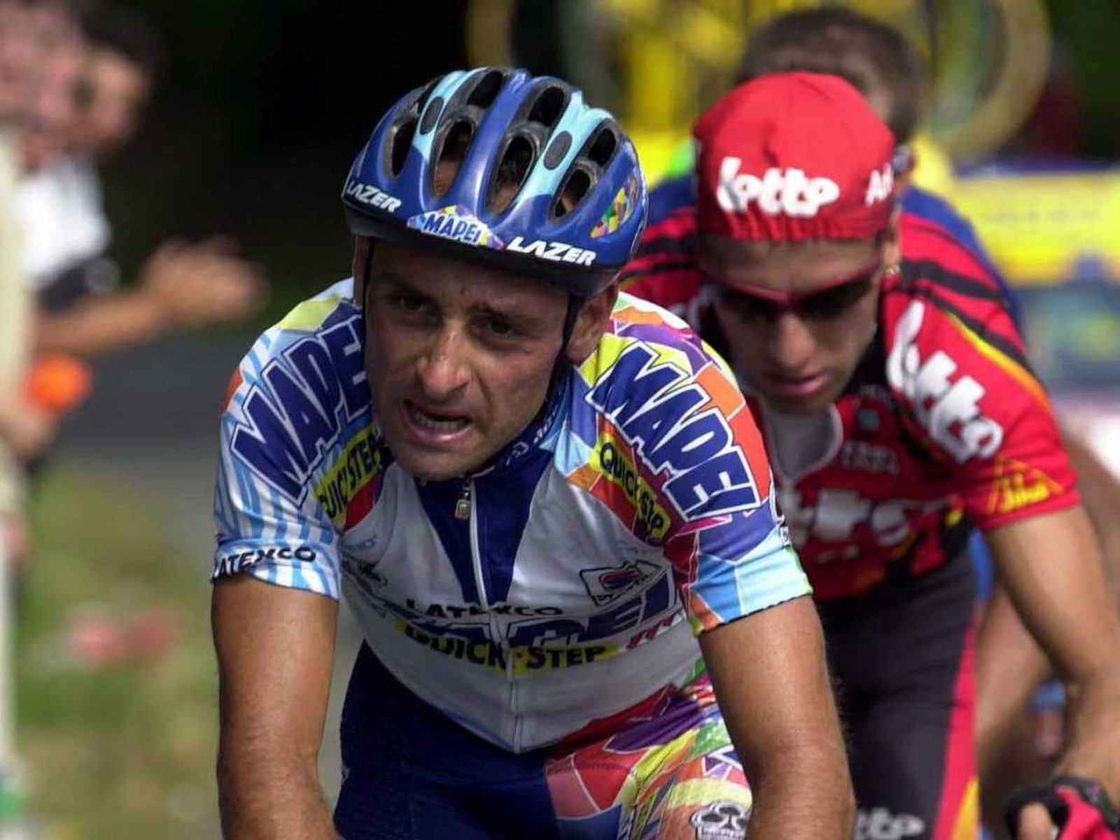 Italy's Olympic champion Paolo Bettini, left, looks at his