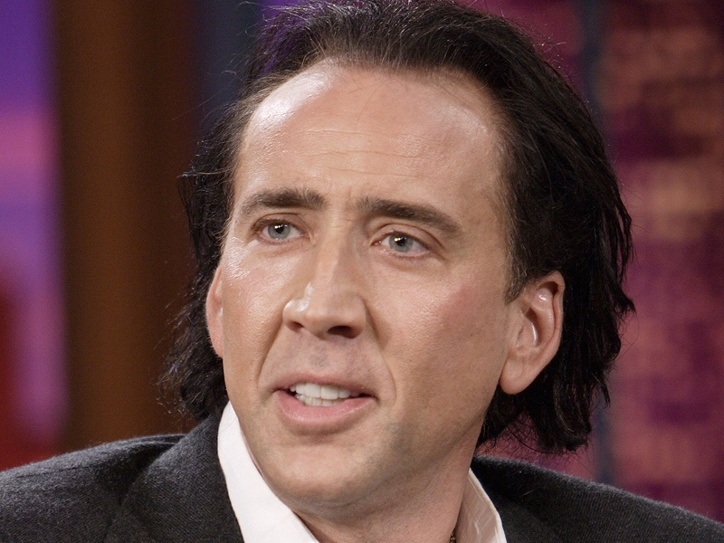 Cage confronts an intruder at home