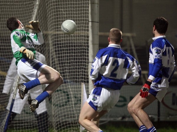 Laois keeper Michael Nolan can only watch as Paddy Bradley's effort travels into the net