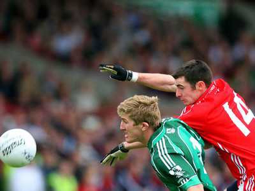 Cork's Donncha O'Connor Cork and Limerick's Johnny McCarthy contest the ball at the Gaelic Grounds