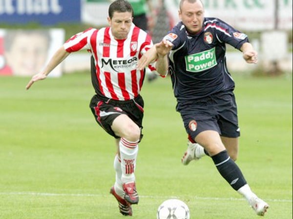 St Pat's hat-trick hero Mark Quigley is chased by Derry's Eddie McCallion