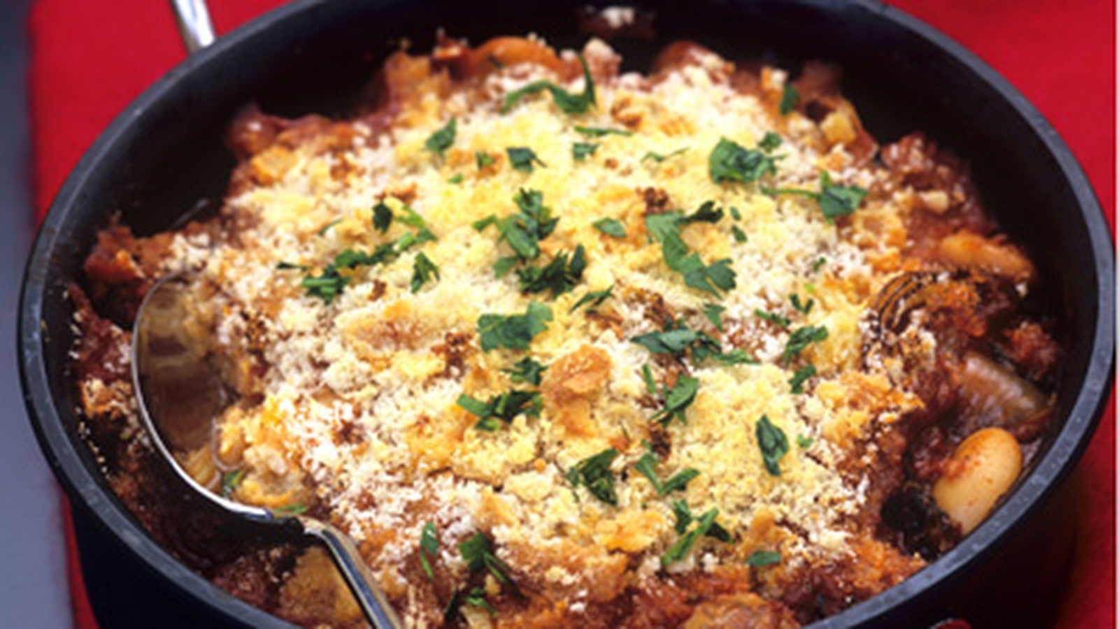 Cassoulet of Baked Beans, Confit Duck, Black Pudding and Parsley Crust