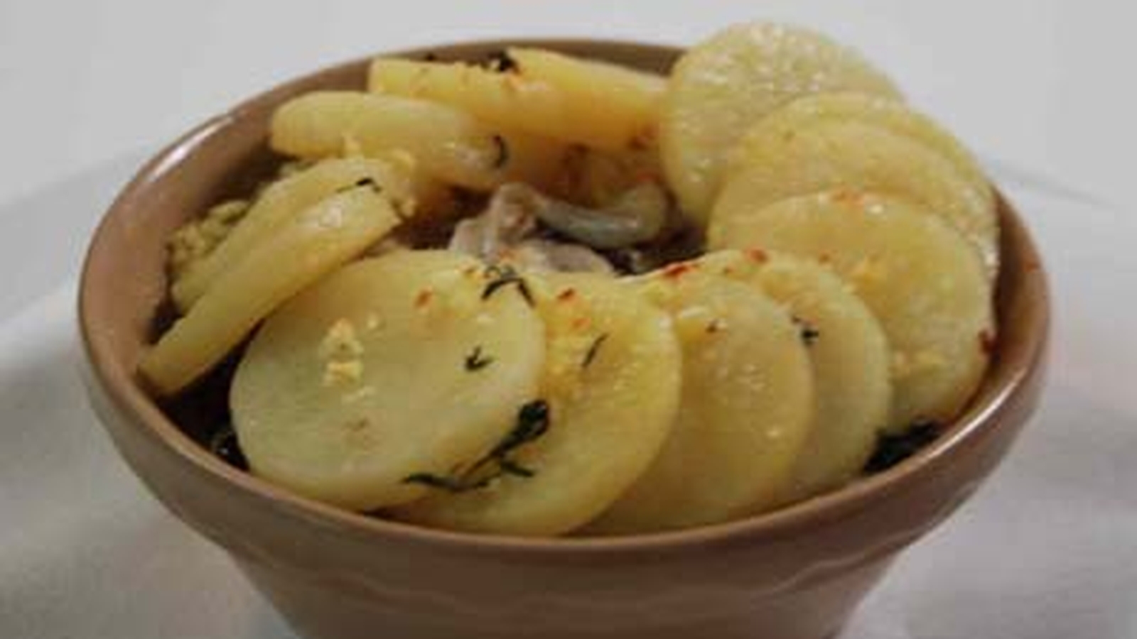 Venison Hot Pot With Potato Rosette And Roast Root Vegetables
