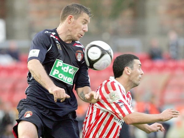 Derry City's Mark Farren and David Partridge of St Pat's challenge for the ball