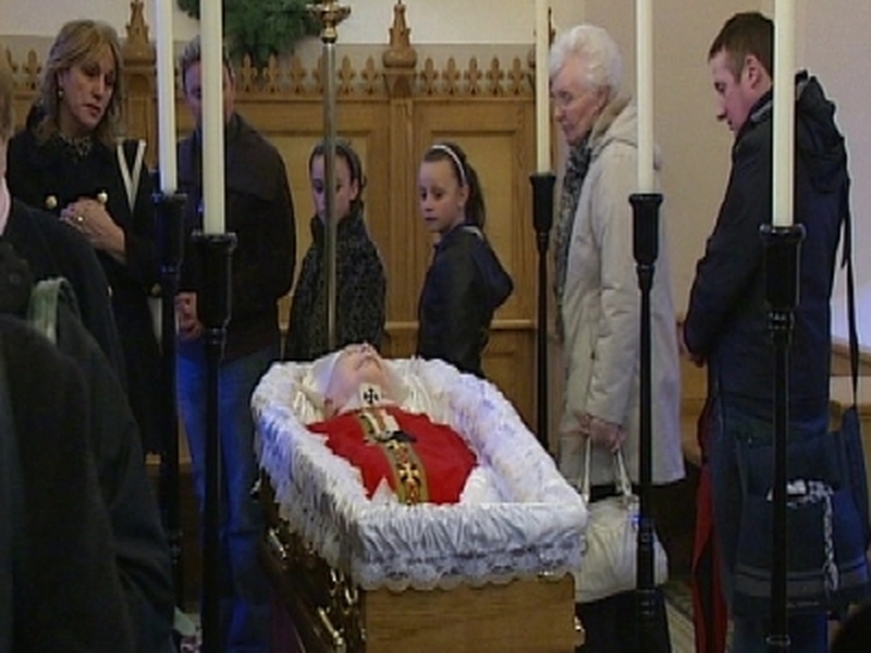 Crowds attend mass for Cardinal Daly