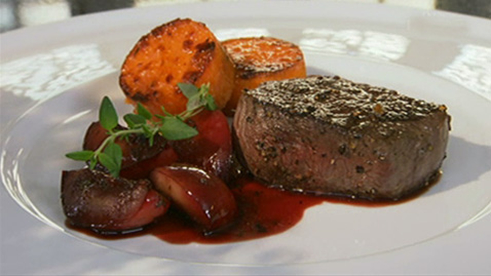 Venison Steaks with Stewed Plums and Roasted Garli