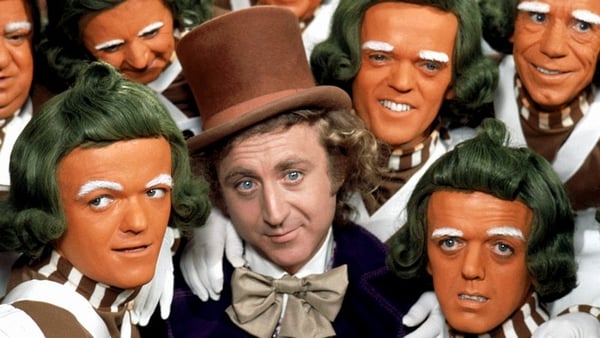 Gene Wilder as Wonka, surrounded by his beloved Oompa-Loompas