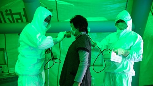 A woman receives the radiation exposure check after leaks at Fukushima nuclear plant