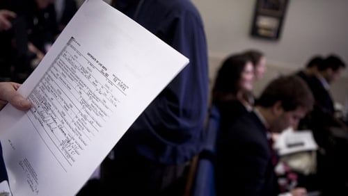 White House - A reporter holds a copy of Barack Obama's birth certificate