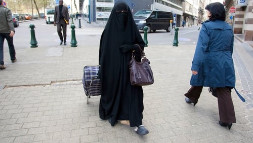 Belgium - A Muslim woman dressed in niqab walks through Brussels