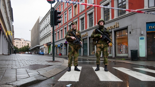 Aftermath - Military stands guard near the site of Friday's bomb