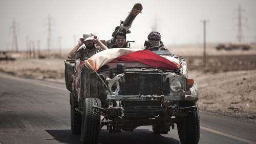 Libya - Rebels drive in an armed truck on the outskirts of Brega