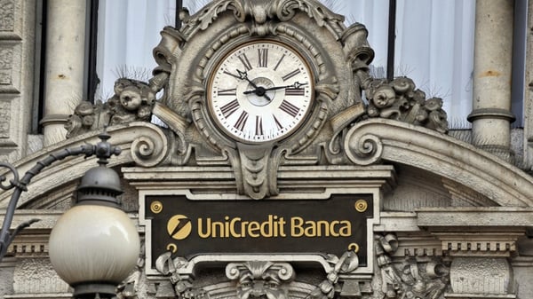 Italy's UniCredit became the first major euro zone bank to write down the value of its loans to reflect the economic impact of Covid-19
