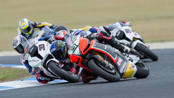Eugene Laverty (right) of Ireland and Aprilia Racing Team leads Marco Melandri (left) of Italy and BMW Motorrad Motorsport during race one in Phillip Island