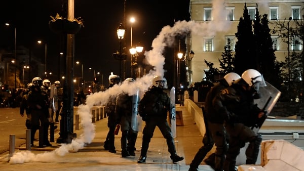 Riot police stand in Athens during clashes with demonstrators
