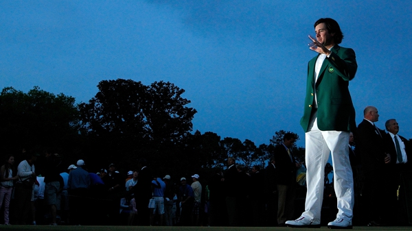 US Masters champion Bubba Watson salutes the crowd, donning the green jacket he earned at Augusta on Sunday
