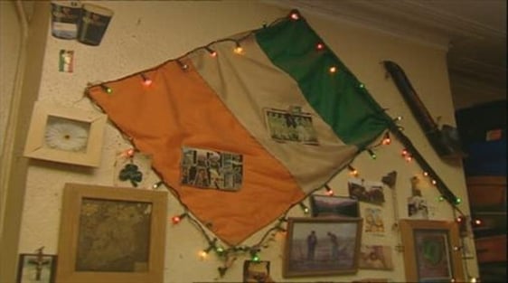 An Irish flag on the bedsit wall of an emigrant in London.