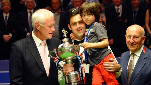 Ronnie O'Sullivan and his son celebrate his fourth world title