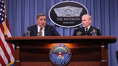 General Martin Dempsey (R) at a press conference with Defence Secretary Leon Panetta